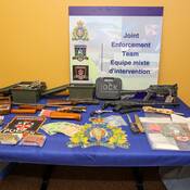 photo of weapons drugs and cash seized in New Haven