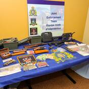 photo of weapons drugs and cash seized in New Haven
