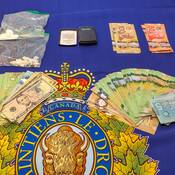 photo of drugs, cash and paraphernalia seized by Provincial JET Team