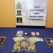 photo of drugs, cash and paraphernalia seized by Provincial JET Team