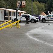 Photo of a Massett RCMP officer demonstrating bike safety in the school parking lot.