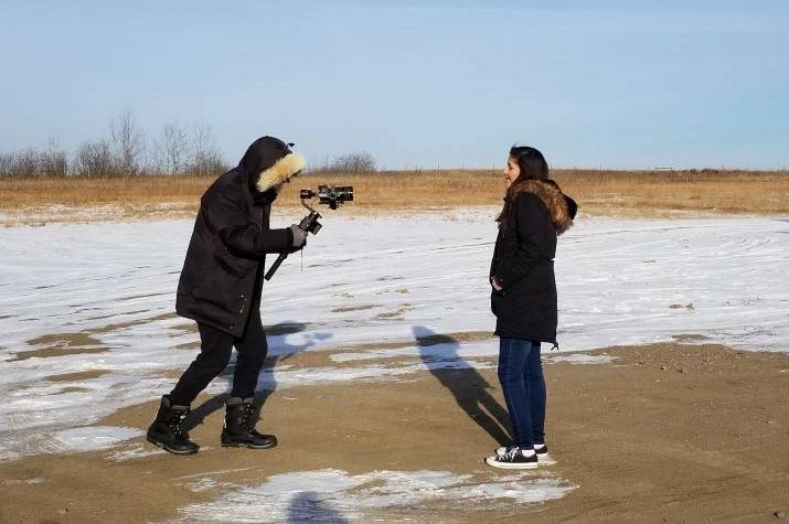 A girl is filmed as she sings. 