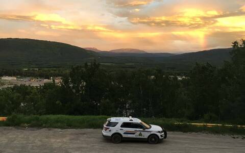 Photo of an RCMP vehicle parked, overlooking the City of Chetwynd.