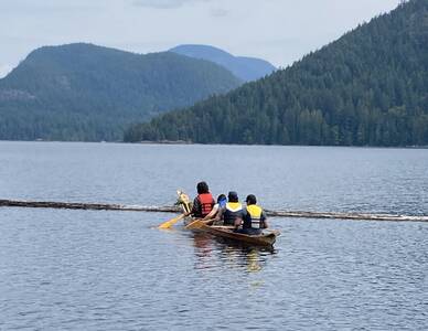 Cedar dugout canoe in the water at Mowat Bay