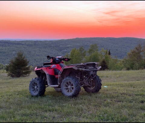 Stolen red 2017 Polaris Sportsman 850 ATV from Tilley, New Brunswick