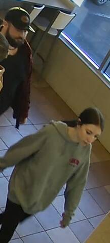 Surveillance image showing two persons of interest in a theft investigation in Salisbury, New Brunswick