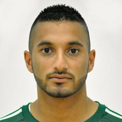 Photo of a man with green shirt.