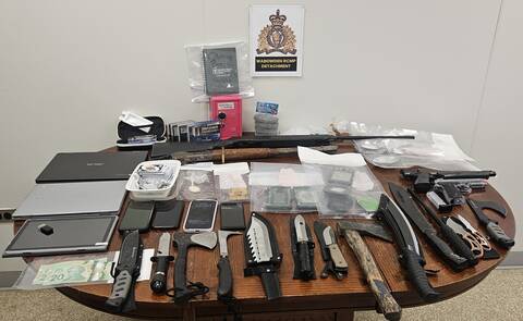 RCMP arrested two people and seized drugs and weapons after executing a search warrant at a Wabowden residence on May 29.