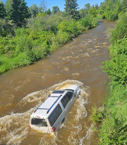 Dauphin RCMP responded to two collisions near Grandview on June 13, including this one off Highway 5 that saw an SUV go into the river.