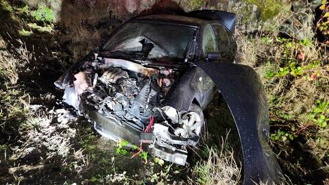 Vehicle after crashing into rock wall