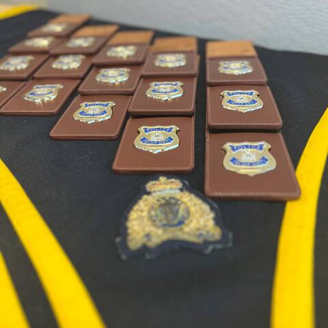 RCMP badges on a ceremonial table
