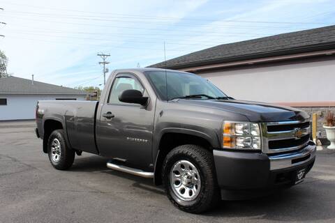 A grey 2010 Chevrolet Silverado pickup truck;