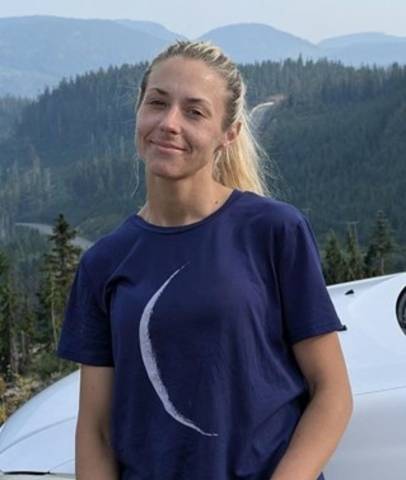 Ashley Bosma, 40-year old apparently Caucasian female. She has long blonde hair pulled into a ponytail and is wearing a dark blue tshirt with a crescent moon on the front.