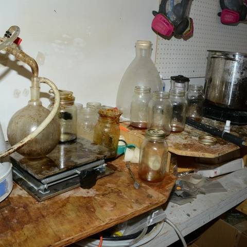 Contaminated glassware and equipment located within the synthetic drug lab