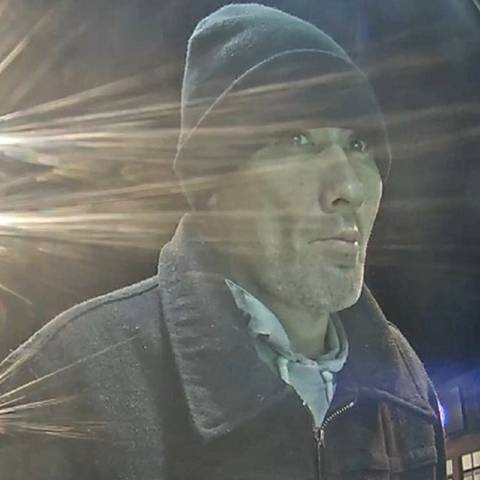 photo of witness with stubbly facial hair wearing a blue toque and blue zip up collared coat