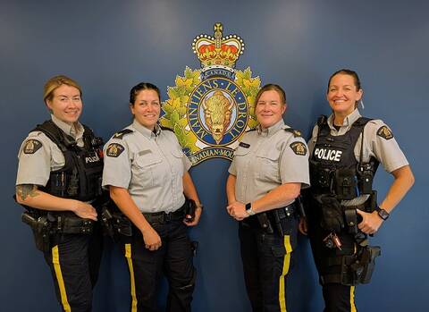 Cst. Rissanen, Cpl. Campbell, Sgt. Moffat, and Cst. Kopf in front of an RCMP logo.