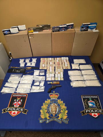 Photograph of drugs, cash and weapons seized by PEI Joint Enforcement Team