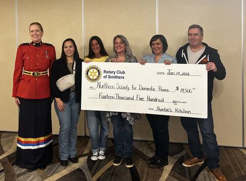 Cst. Jocelyn Foidart standing next to Shannon William, Bronwyn Young and the Rotary Club of Smithers holding a cheque for $14, 500