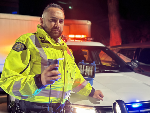 RCMP officer operating breathalyzer equipment roadside