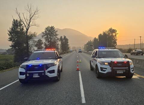 Two BC Highway Patrol cruisers at a collision