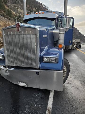 This blue Kenworth tractor-trailer unit was involved in a fatal collision with a green Volvo tractor-trailer. Police are asking for more witnesses who saw the trucks on the day of the collision