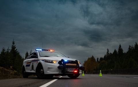 A BC Highway Patrol cruiser at a collision