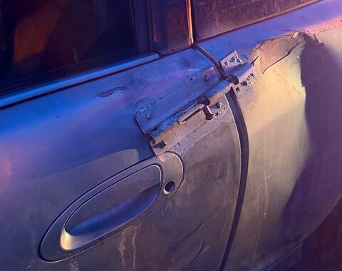 A close-up of garden gate latch that was holding the driver’s door closed on to this Acura