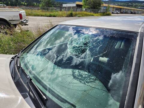 The smashed windshield of a Toyota Camry where the unbelted driver’s head hit the glass