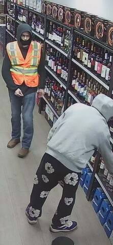 Surveillance image of two suspects sought in a Fort Saskatchewan liquor store theft investigation