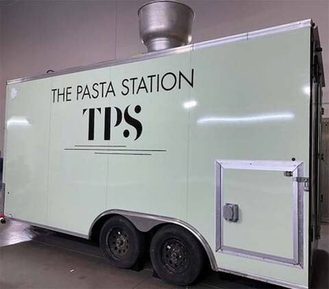 Side view of the stolen mint green food trailer with The Pasta Station TPS branding