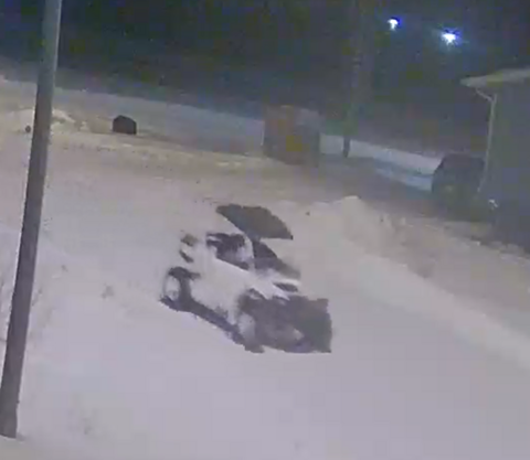 A white side-by-side with a black roof.