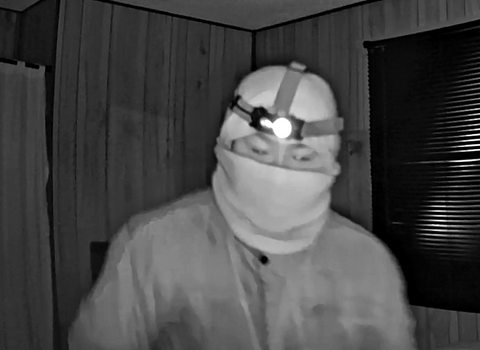 Surveillance image of a masked suspect in a Fort Providence residential break and enter investigation