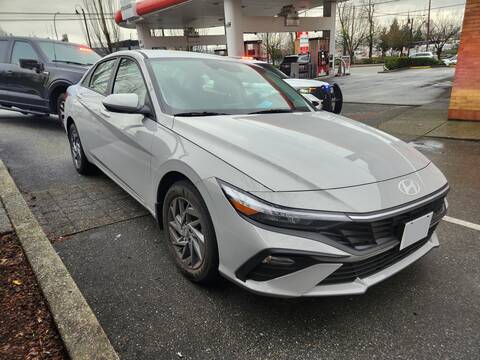 Photo of car stopped in relation to drug trafficking investigation, with two police vehicles behind it