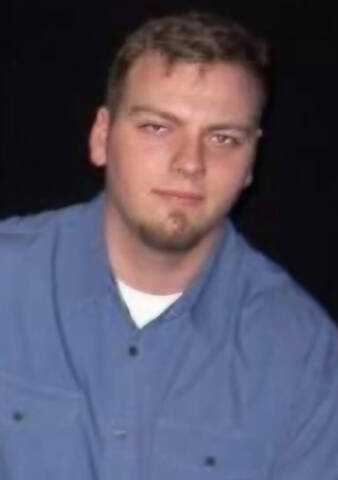 An image of Robert Girbav wearing a blue shirt