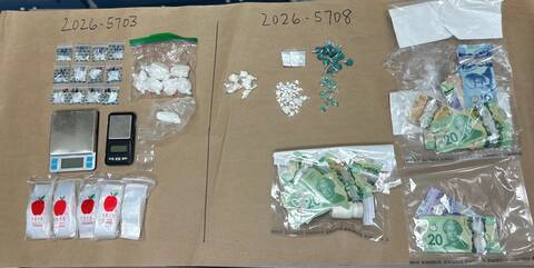 Top down photo of suspected illicit drugs and cash seized during enforcement on March 25, 2026