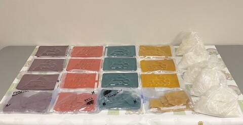 A photograph of the seized fentanyl and methamphetamine in bags on a table.