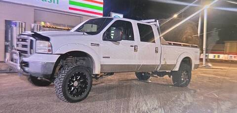 Stolen white Ford F350 crew cab with aluminum bed rails and headache rack