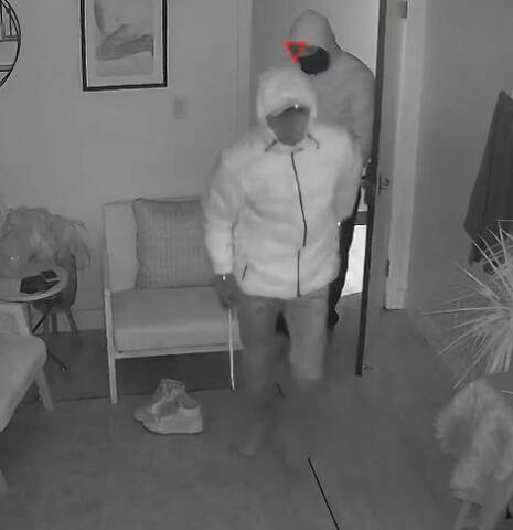 Surveillance image of suspect in Cochrane business break and enter investigation