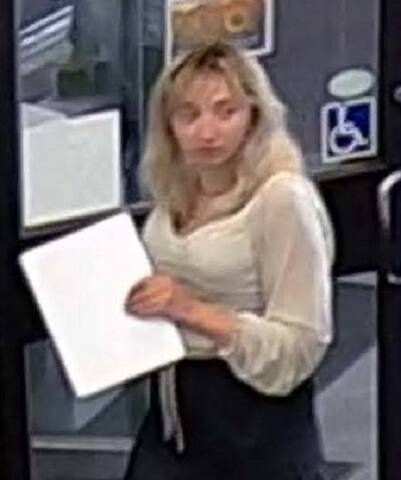 photo of female suspect wearing white shirt