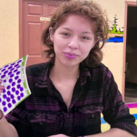 Young woman with curly brown hair
