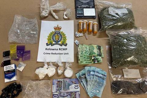 Photo of illegal street drugs, weapons and drug trafficking equipment