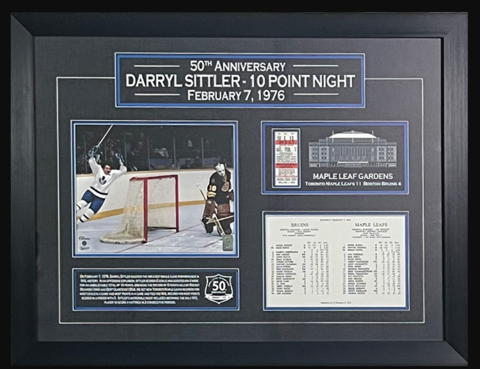 Surveillance photo of stolen framed NHL memorabilia from Bay Roberts hardware store