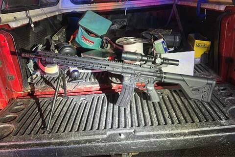 Photo of replica carbine sitting in the back of a truck with the hatch down