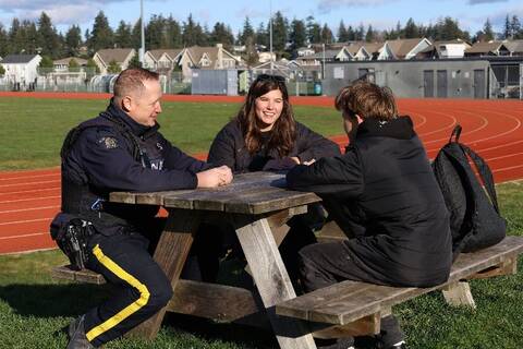 Photo: West Shore RCMP Cpl. Brewer with PCFSA Youth Counsellor Caitlin Anderson