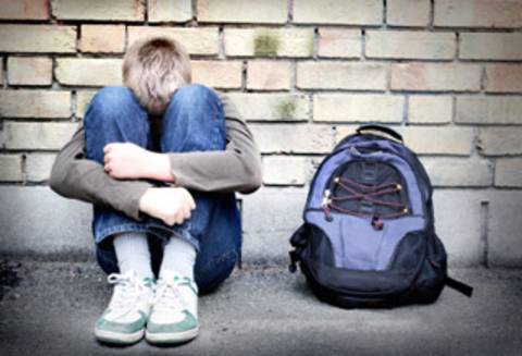 Boy sitting alone