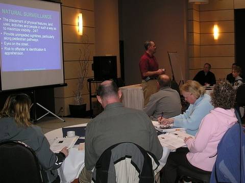 Image of members of the public participating in a community policing presentation