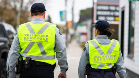 Two auxiliaries walking in vests