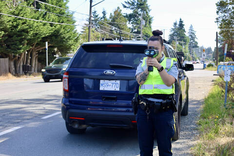 Officer using handheld radar to conduct speed enforcement