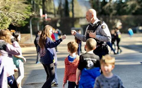 RCMP member interacting with a child
