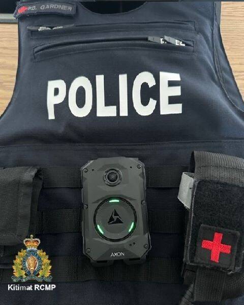 photo of police soft body armor with body worn camera attached